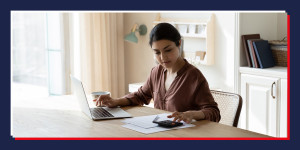 Woman planning a budget with a laptop and calculator