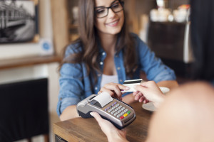 Person cutting up their credit cards once and for all in favor of personal loans